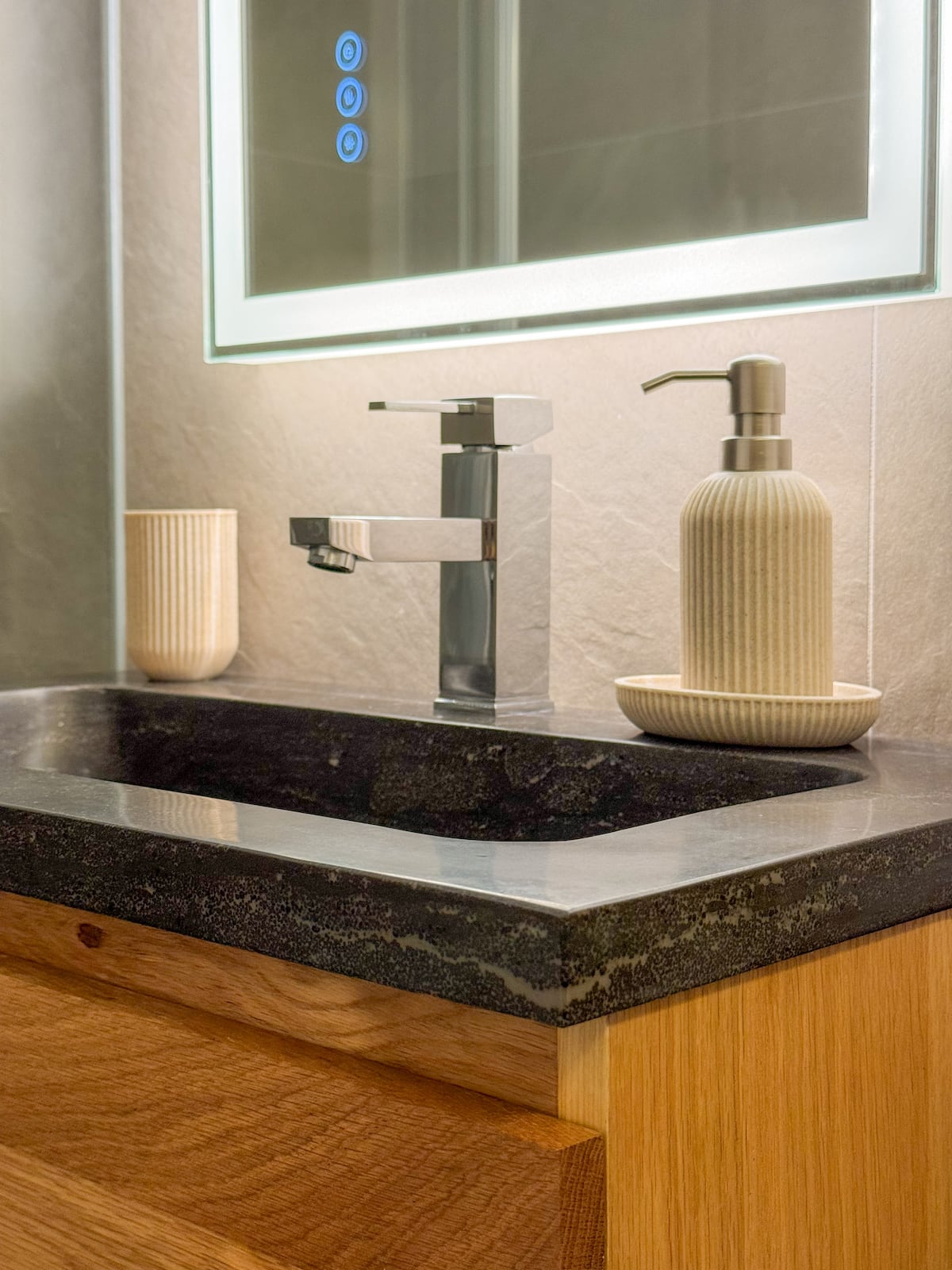 Contemporary bathroom with wooden vanity and stone countertop